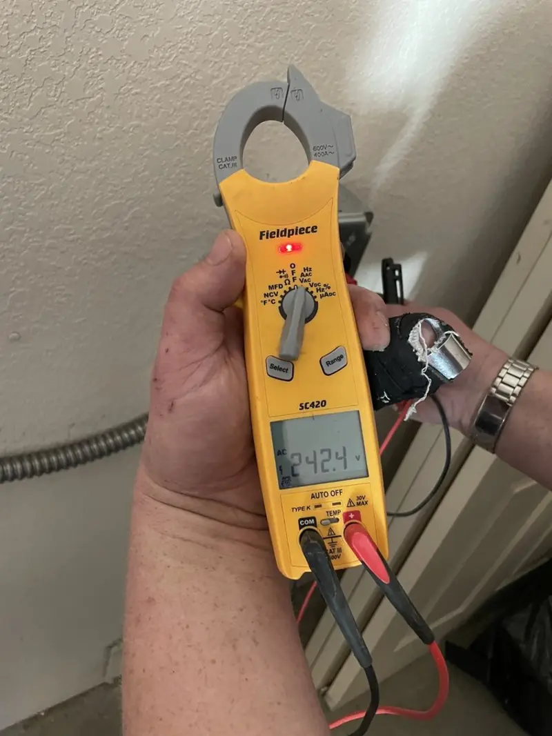 Voltage testing with clamp meter during Ceiling Fan Installation in Cumberland